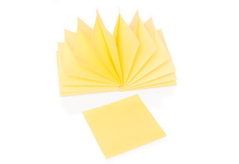 Image showing Blank yellow sticky note and block on white