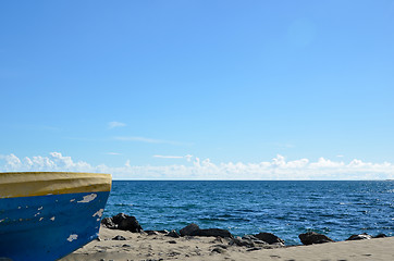 Image showing Coastal view with a colorful boat