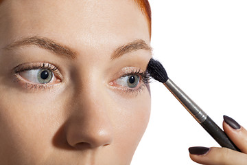 Image showing Pretty Woman Applying Eye Shadow Makeup