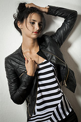 Image showing Woman in Black Leather Jacket Holding her Hair