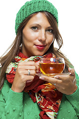 Image showing Attractive woman warming up with a cup of hot tea