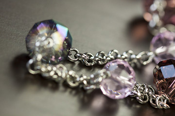 Image showing Attractive shiny purple beads on jewellery