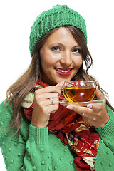 Image showing Attractive woman warming up with a cup of hot tea