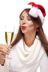 Image showing Playful woman celebrating Xmas blowing a kiss