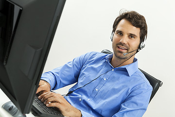 Image showing Man wearing headset giving online chat and support