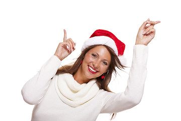 Image showing Young woman in a Santa hat holding out her hands