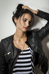 Image showing Woman in Black Leather Jacket Holding her Hair