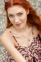 Image showing Pretty Blond Woman Sitting on Red Chair