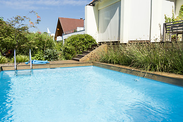 Image showing Swimming Pool next to Modern Building