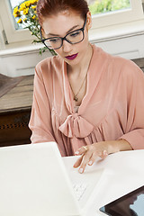 Image showing Young Businesswoman Looking at Computer Seriously