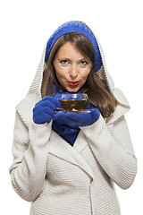 Image showing Fashionable young woman sipping hot tea