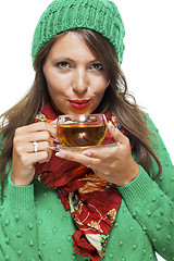 Image showing Attractive woman warming up with a cup of hot tea