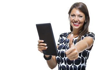 Image showing Smiling Woman in a Dress Holding a Tablet Computer