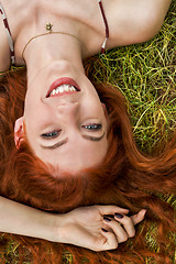 Image showing Happy Woman Lying on Grassy Ground