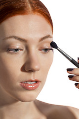 Image showing Pretty Woman Applying Eye Shadow Makeup