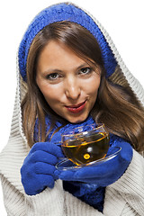 Image showing Fashionable young woman sipping hot tea