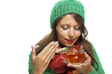 Image showing Attractive woman warming up with a cup of hot tea