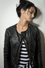 Image showing Woman in Black Leather Jacket Holding her Hair