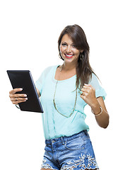 Image showing Pretty Woman Browsing at her Tablet Computer