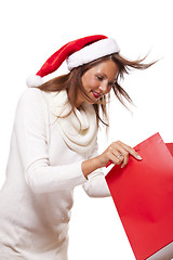 Image showing Happy vivacious Christmas shopper