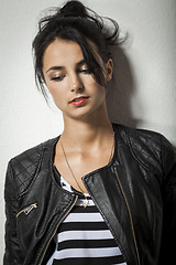 Image showing Woman in Black Leather Jacket Holding her Hair