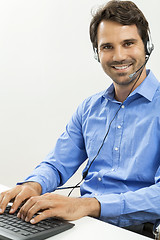 Image showing Man wearing headset giving online chat and support