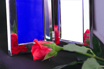 Image showing silver frame and red rose