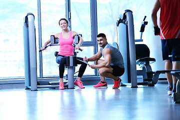 Image showing woman exercising with her personal trainer