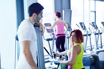 Image showing woman exercising with her personal trainer