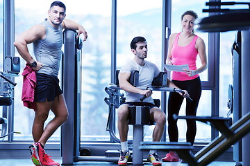 Image showing woman exercising with her personal trainer