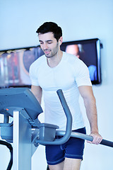 Image showing man running on the treadmill