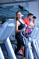 Image showing woman exercising on treadmill in gym