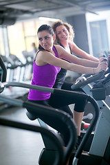 Image showing Group of people running on treadmills