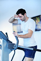 Image showing man running on the treadmill