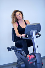 Image showing woman exercising on treadmill in gym