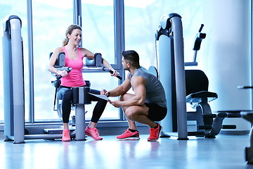 Image showing woman exercising with her personal trainer