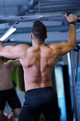 Image showing handsome man exercising at the gym