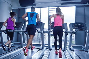 Image showing woman exercising on treadmill in gym