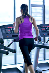 Image showing woman exercising on treadmill in gym