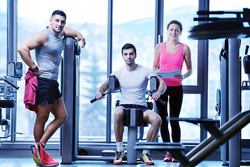 Image showing woman exercising with her personal trainer