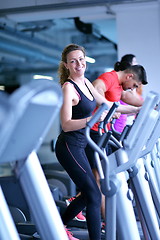 Image showing woman exercising on treadmill in gym