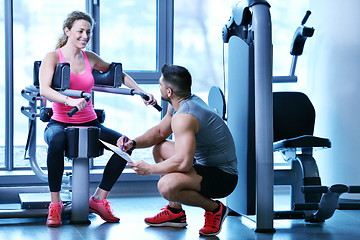 Image showing woman exercising with her personal trainer