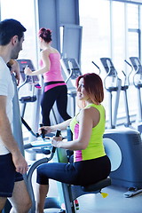 Image showing woman exercising with her personal trainer