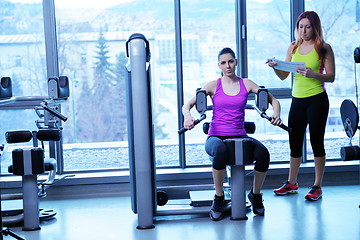 Image showing woman exercising with her personal trainer