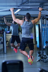 Image showing handsome man exercising at the gym