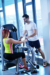 Image showing woman exercising with her personal trainer