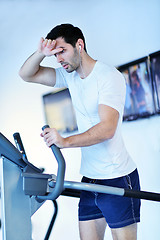 Image showing man running on the treadmill