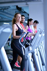 Image showing woman exercising on treadmill in gym