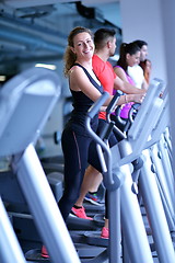 Image showing woman exercising on treadmill in gym