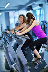 Image showing Group of people running on treadmills